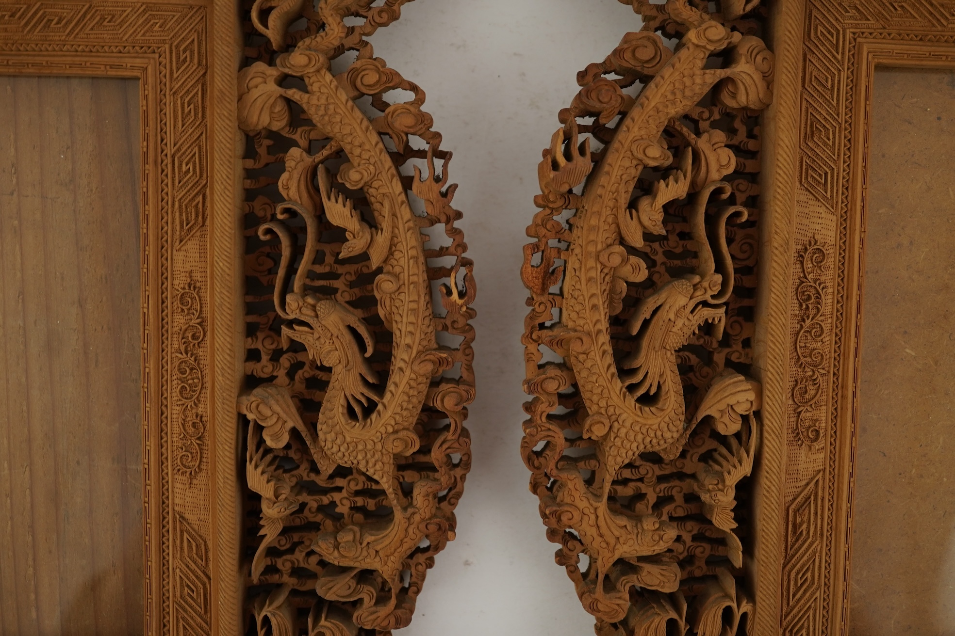 A pair of Chinese carved sandalwood frames, late 19th century
